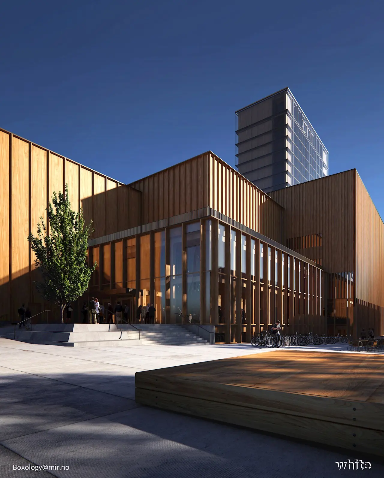 Moderne Gebäude mit Holzverkleidung, großen Fenstern und einer Glasfassade. Eingangsbereich mit Treppe und Sitzgelegenheit.